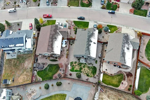 an aerial view of residential houses with outdoor space