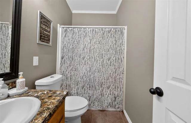 a bathroom with a toilet and a sink