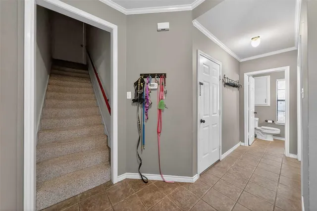 a view of a hallway with wooden shelves