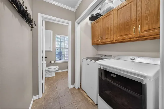 a utility room with a sink a washer and dryer