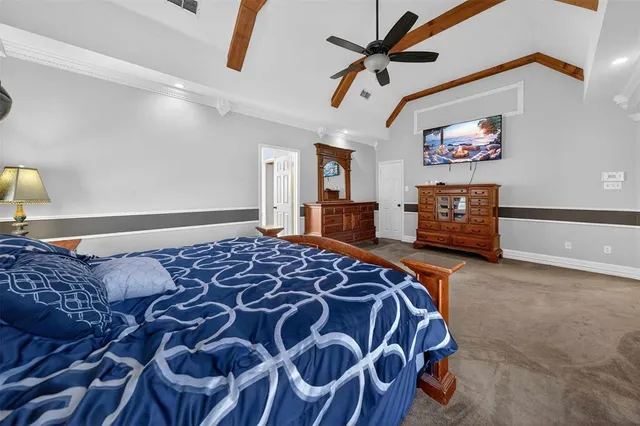 a bedroom with a bed and dresser