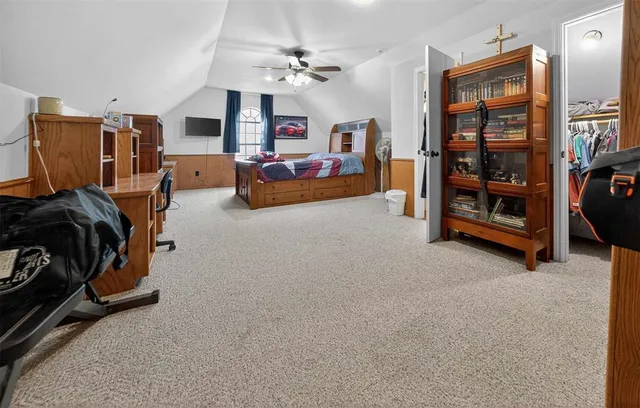 a living room with furniture and a flat tv screen