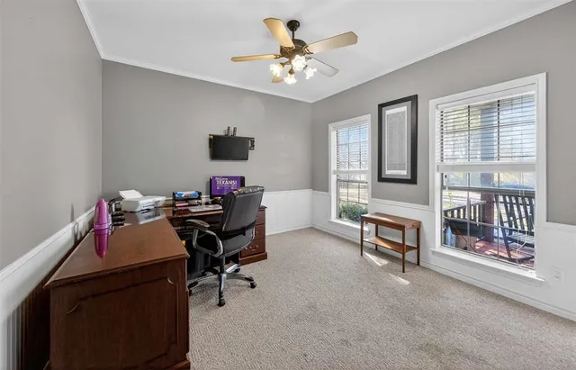 a work room with furniture and a window