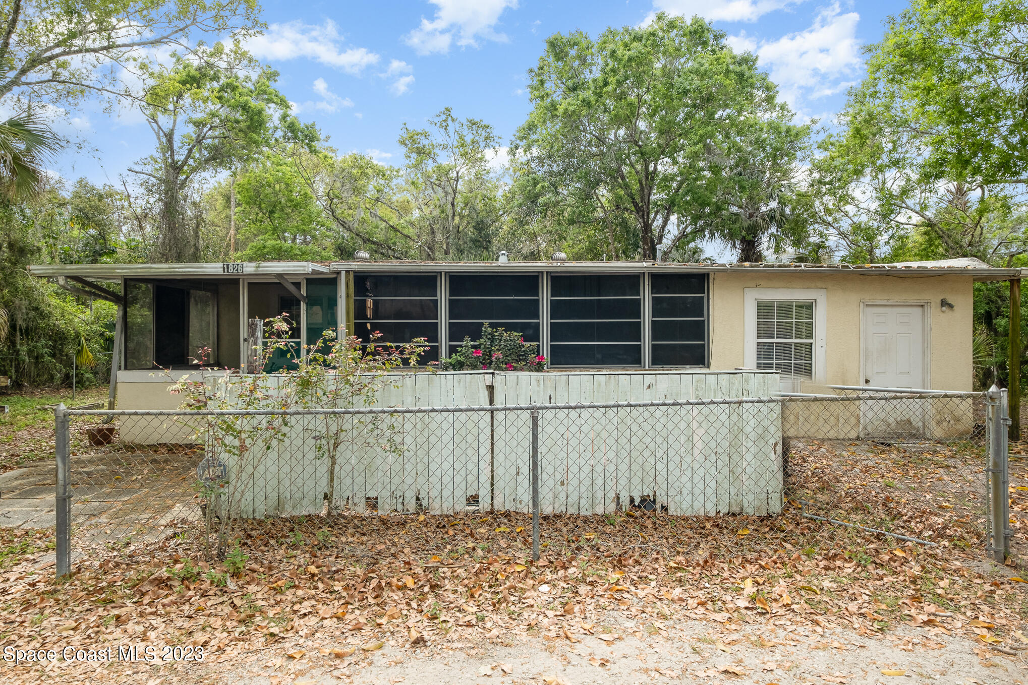 1826 Lemay Drive Northeast Palm Bay, FL 32905 - Photo 1 of 31 front view of a house with a large window