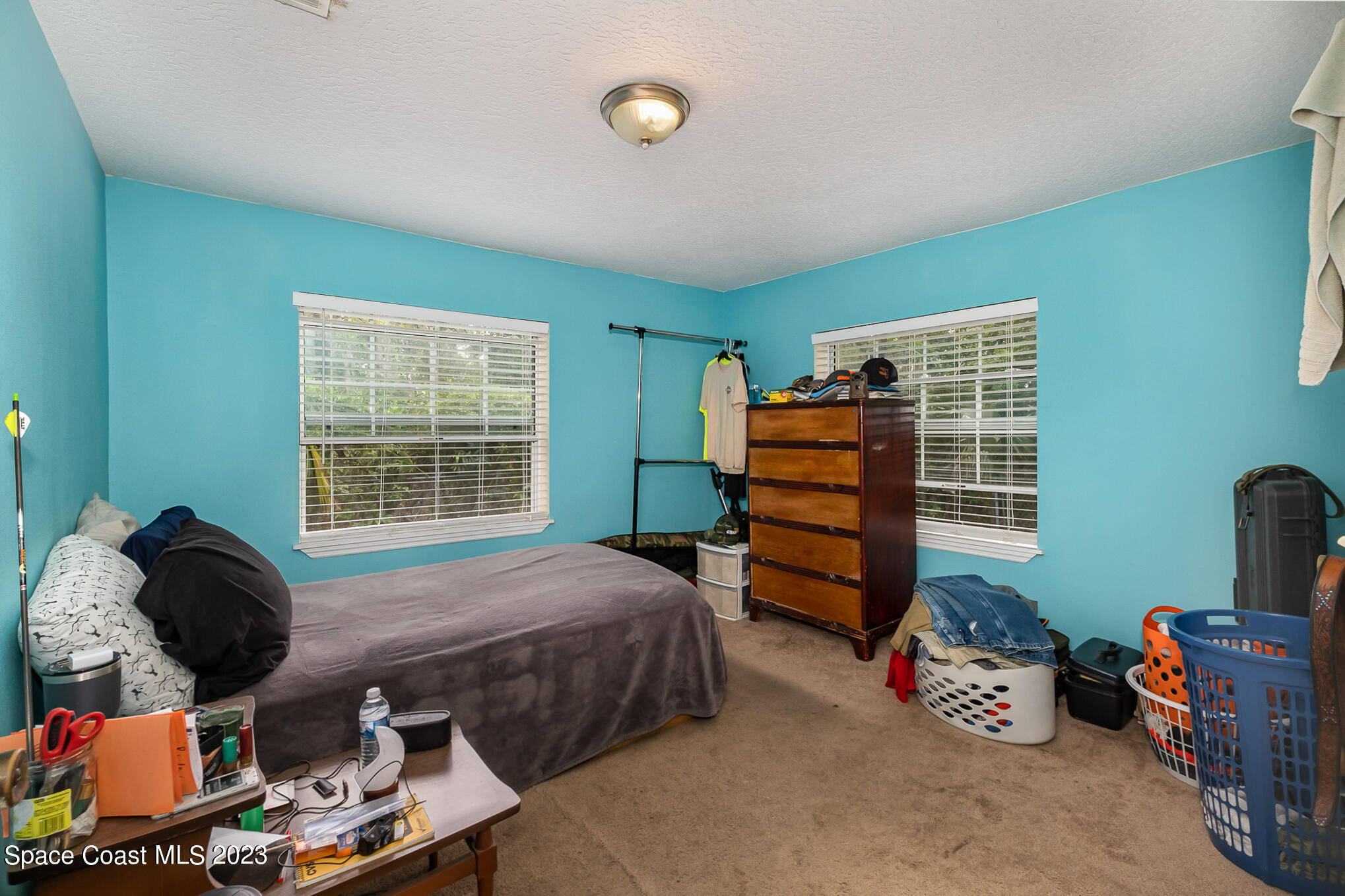 1826 Lemay Drive Northeast Palm Bay, FL 32905 - Photo 18 of 31 a bedroom with furniture and a window