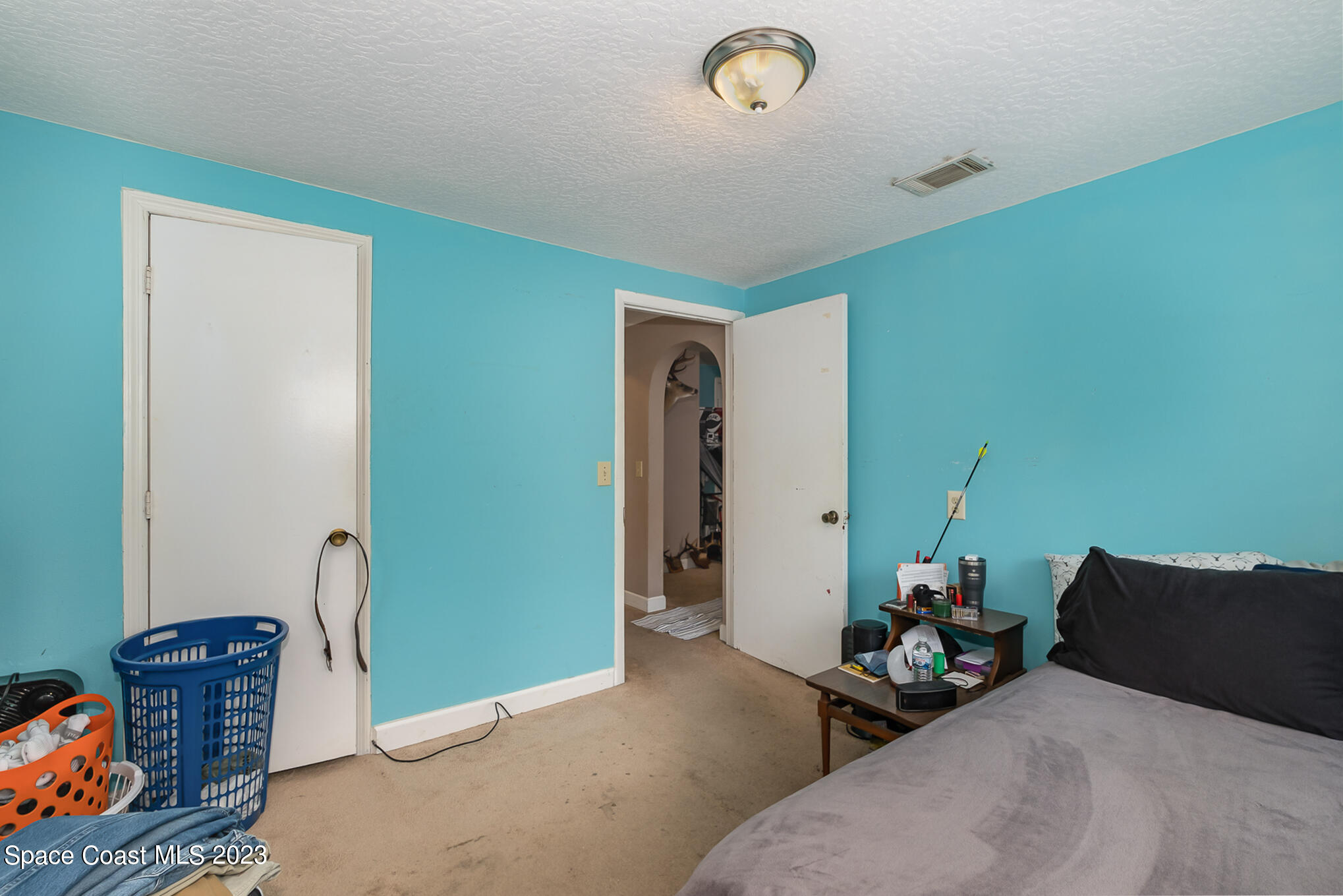 1826 Lemay Drive Northeast Palm Bay, FL 32905 - Photo 19 of 31 a bed room with furniture and a window