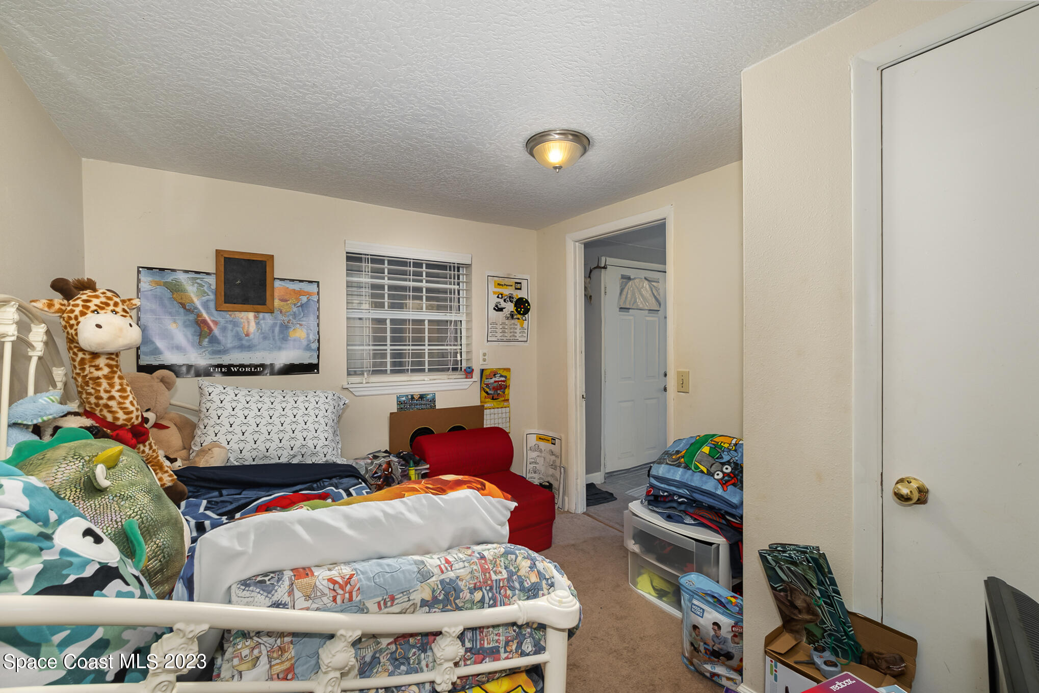 1826 Lemay Drive Northeast Palm Bay, FL 32905 - Photo 21 of 31 a bedroom with furniture and a window