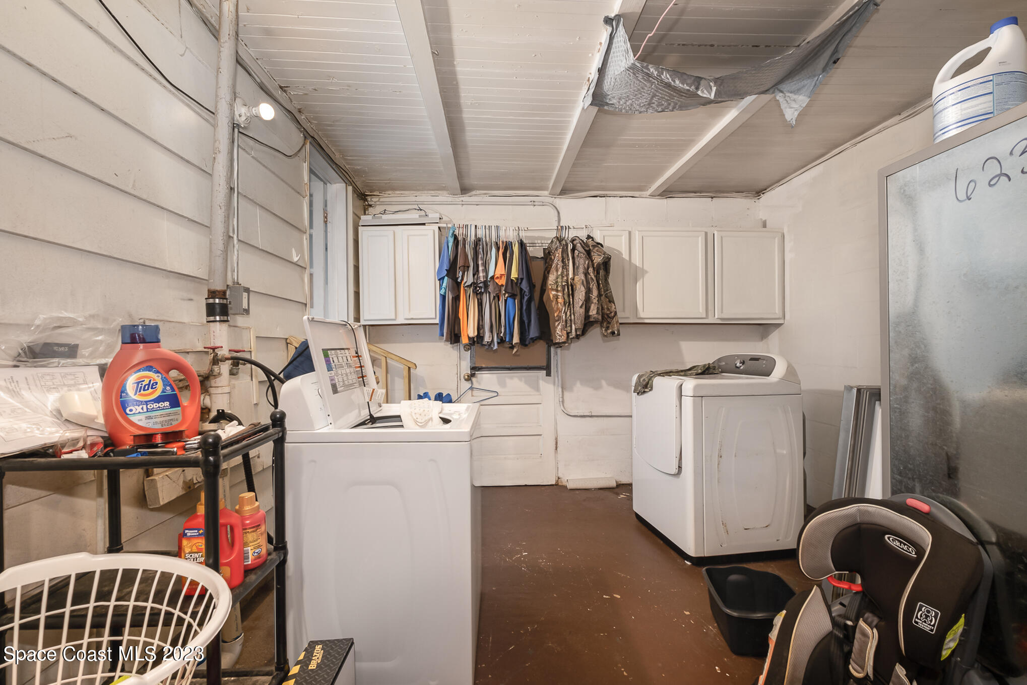 1826 Lemay Drive Northeast Palm Bay, FL 32905 - Photo 28 of 31 a storage room with washer and dryer