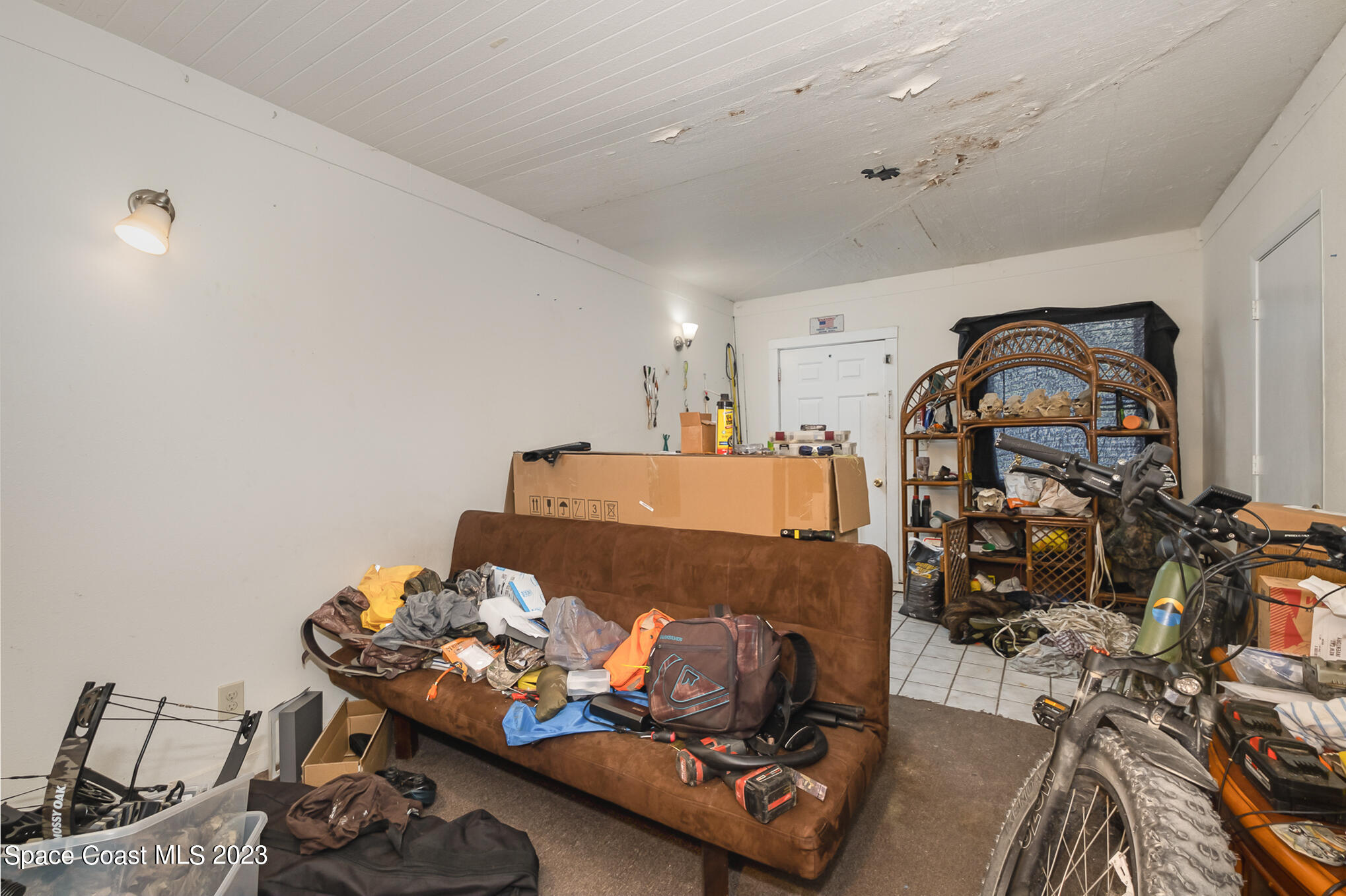 1826 Lemay Drive Northeast Palm Bay, FL 32905 - Photo 29 of 31 a living room with furniture and a wooden floor