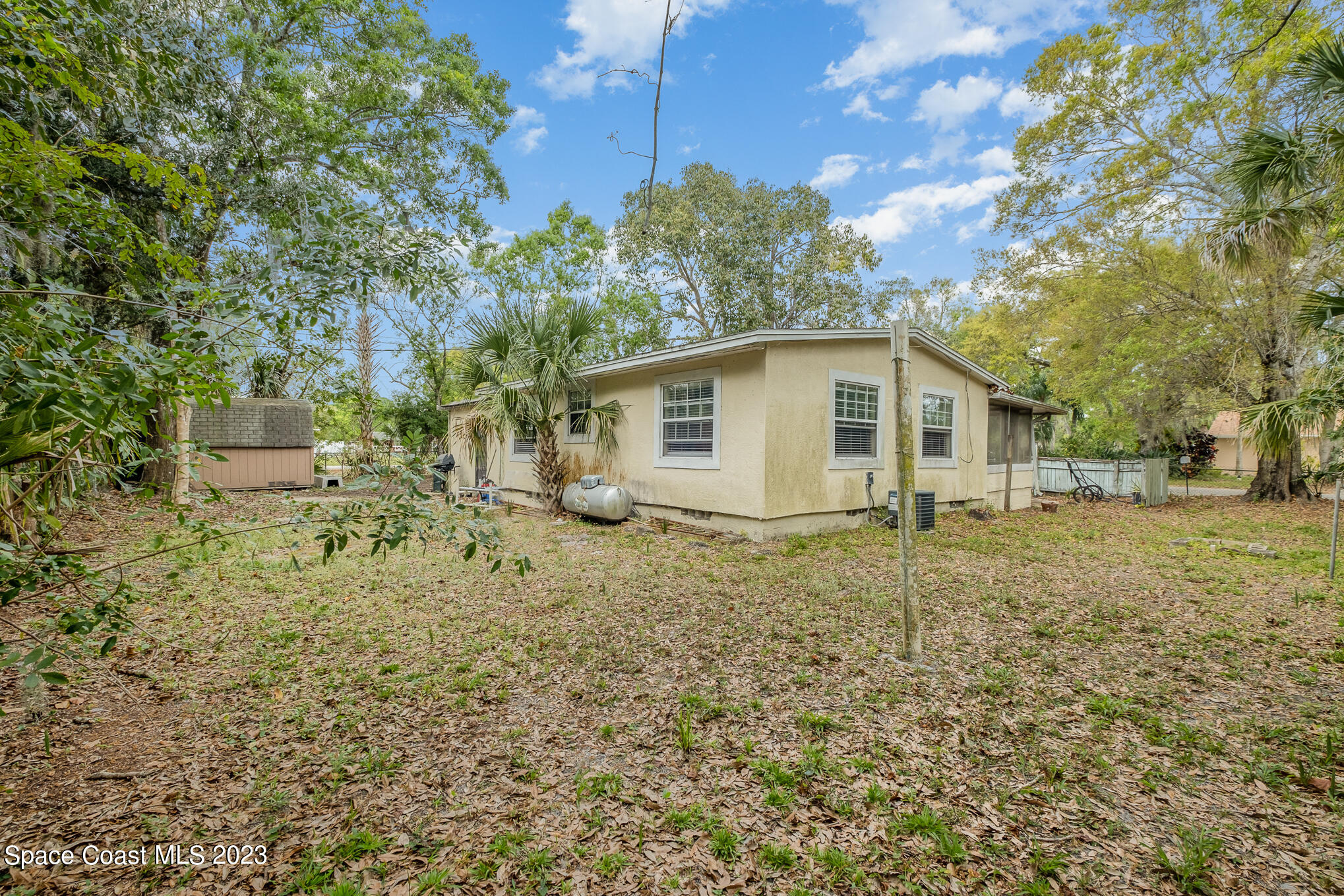 1826 Lemay Drive Northeast Palm Bay, FL 32905 - Photo 6 of 31 a view of a house with a yard