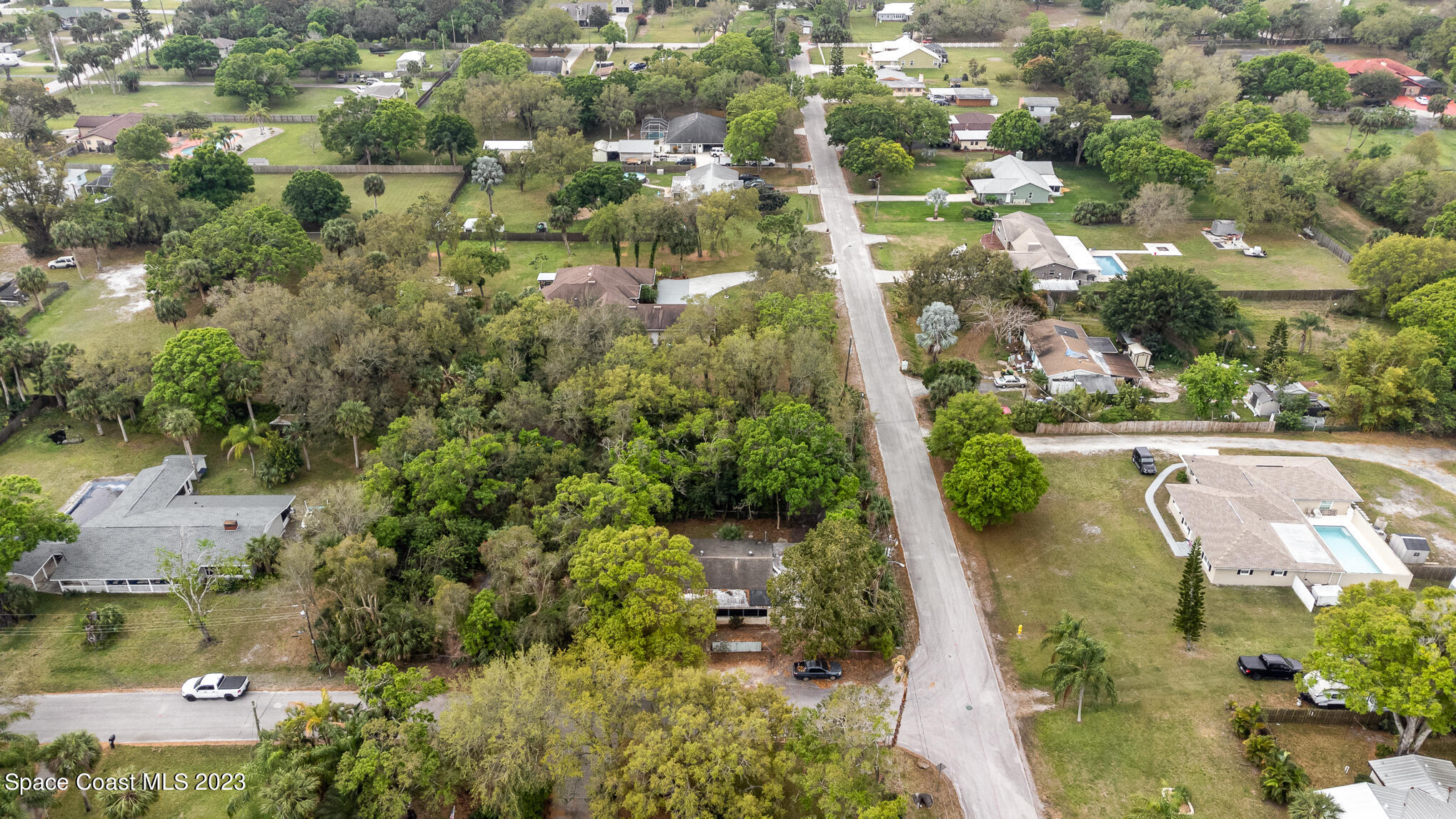 1826 Lemay Drive Northeast Palm Bay, FL 32905 - Photo 8 of 31 an aerial view of residential houses with outdoor space and trees