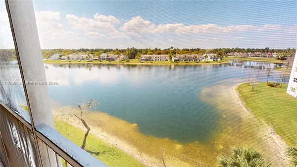 a kitchen with a sink a refrigerator a stove a washer dryer and cabinets