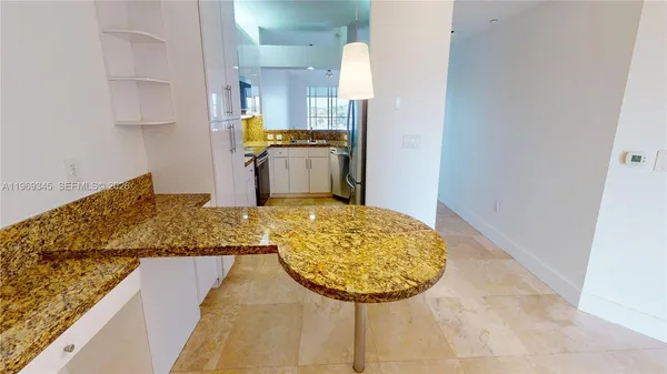 a kitchen with a stove and a microwave