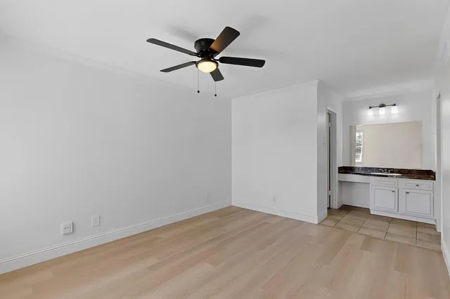 a view of a kitchen with a sink and a stove