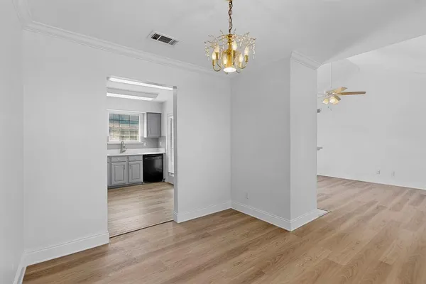 a view of a kitchen with a sink wooden floor and a kitchen