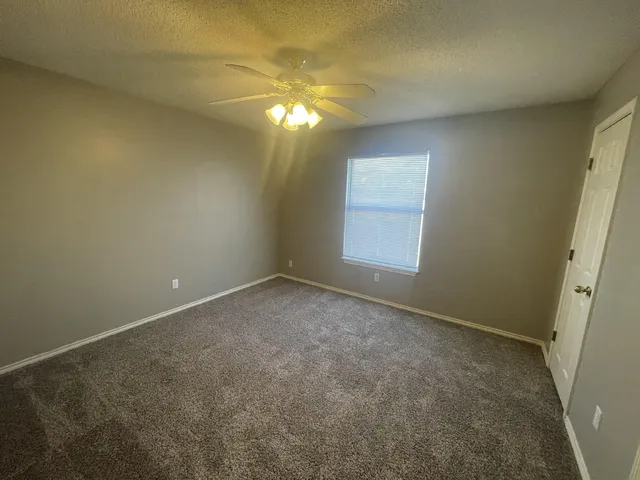 an empty room with a empty space and a window