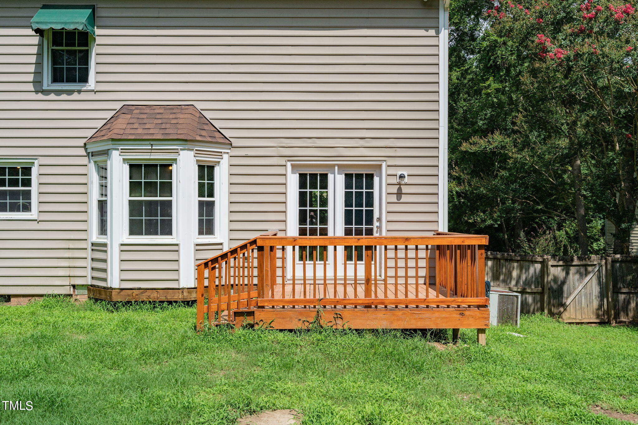 9301 Tallgrass Road Raleigh, NC 27603 - Photo 33 of 41 a view of a house with a yard and deck