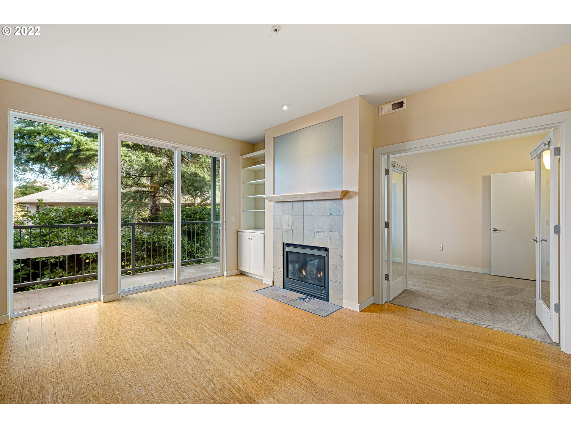 347 Rustic Place, Unit 8 Eugene, OR 97401 - Photo 15 of 31 a view of empty room with floor to ceiling window and an empty room