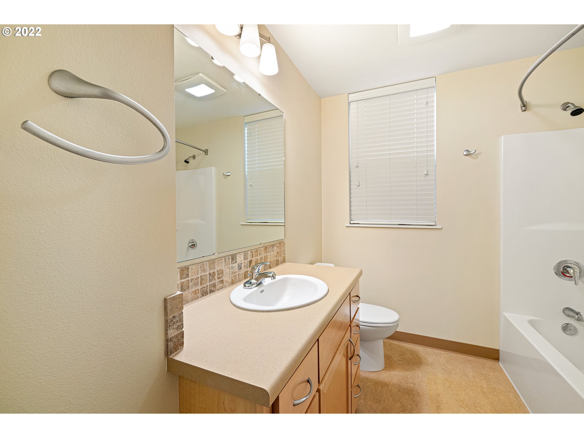 347 Rustic Place, Unit 8 Eugene, OR 97401 - Photo 20 of 31 a bathroom with a sink a toilet and shower