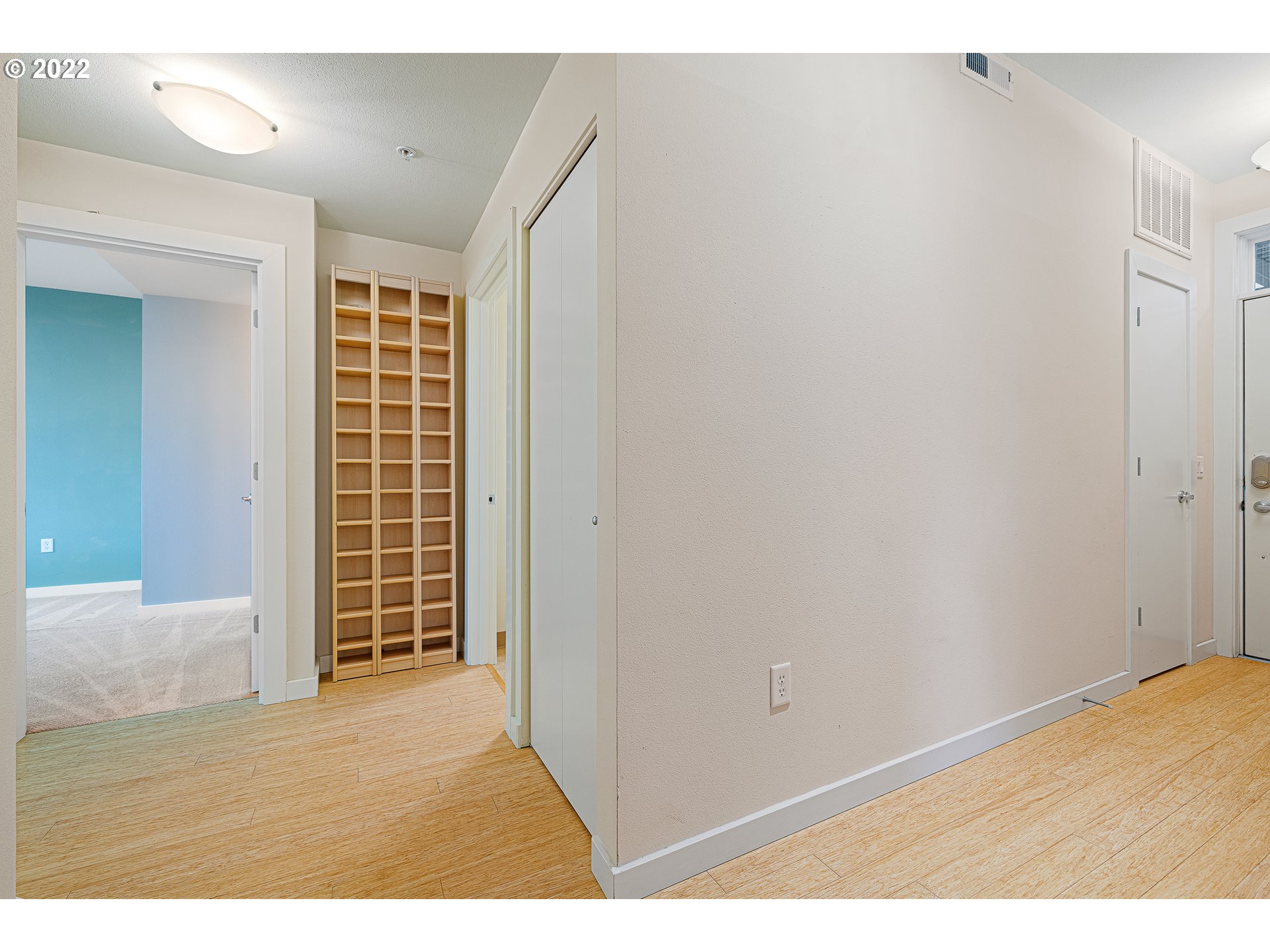 347 Rustic Place, Unit 8 Eugene, OR 97401 - Photo 23 of 31 an empty room with wooden floor and windows