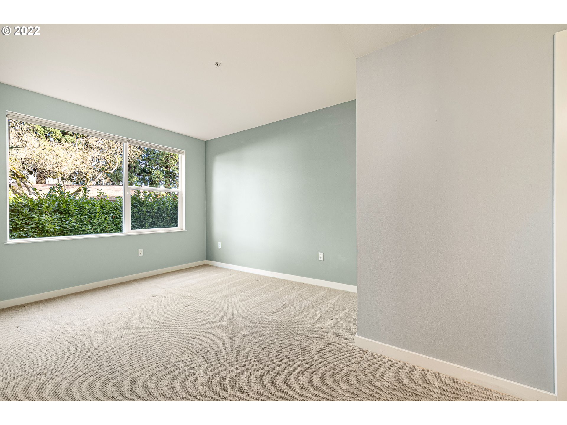 347 Rustic Place, Unit 8 Eugene, OR 97401 - Photo 25 of 31 a view of an empty room with a window