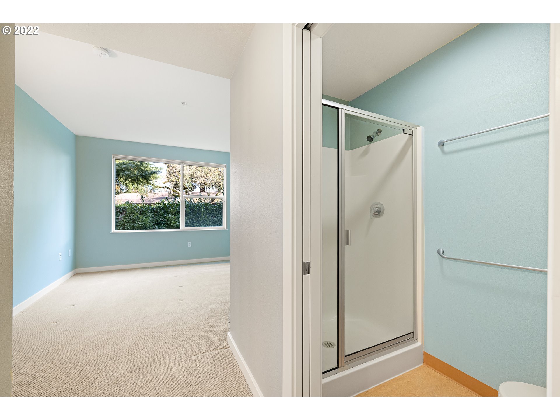 347 Rustic Place, Unit 8 Eugene, OR 97401 - Photo 27 of 31 a view of a big room with wooden floor and a floor to ceiling window