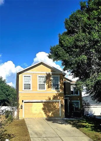 a front view of a house with parking