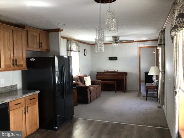 a kitchen with refrigerator a sink and cabinets
