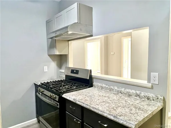 a kitchen with a stove and a sink