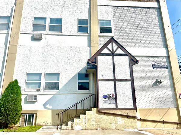 a front view of a building with street view