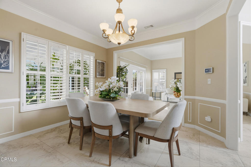 11543 Ragusa Drive Rancho Cucamonga, CA 91701 - Photo 14 of 69 a view of a dining room with furniture and a chandelier