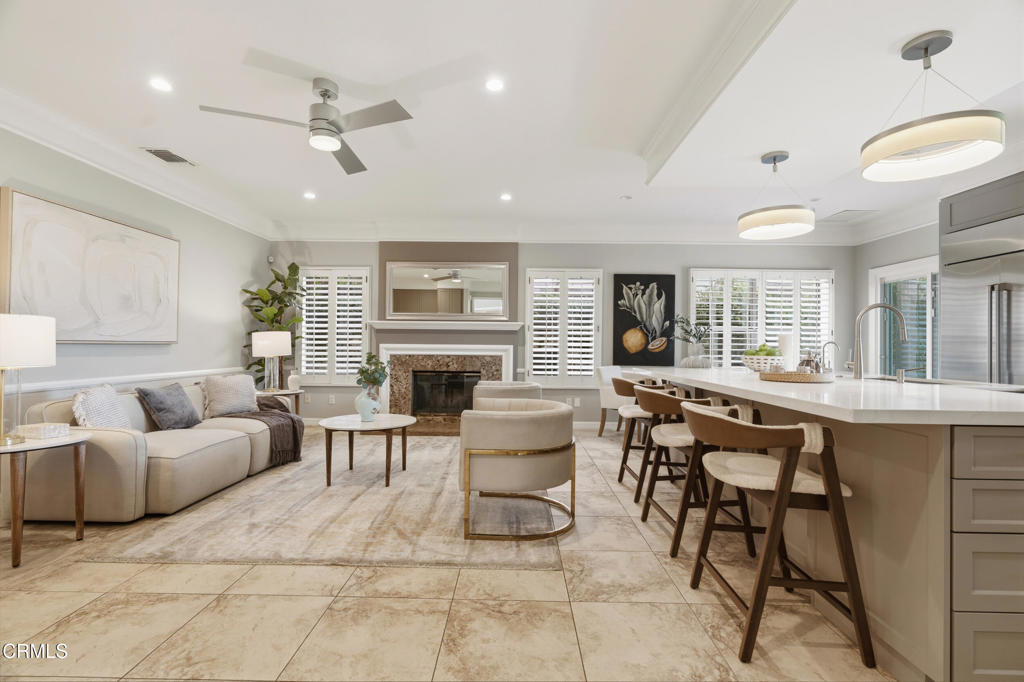 11543 Ragusa Drive Rancho Cucamonga, CA 91701 - Photo 15 of 69 a living room with furniture a fireplace and a table