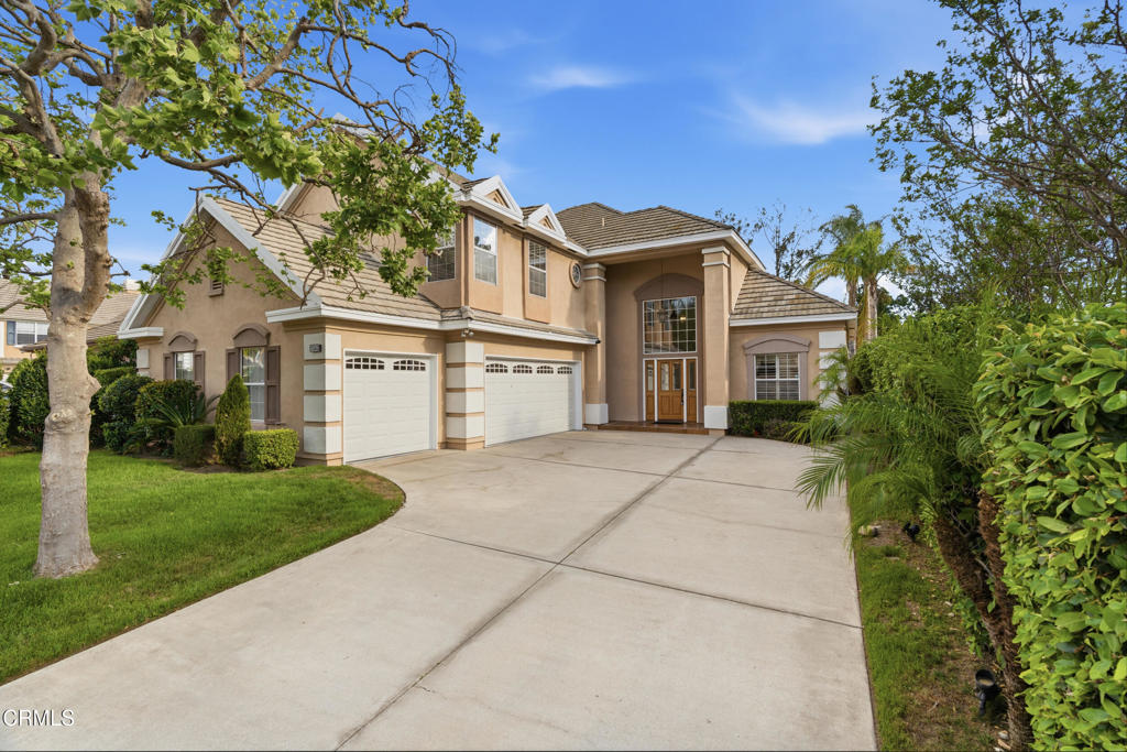 11543 Ragusa Drive Rancho Cucamonga, CA 91701 - Photo 2 of 69 a front view of a house with a yard and trees