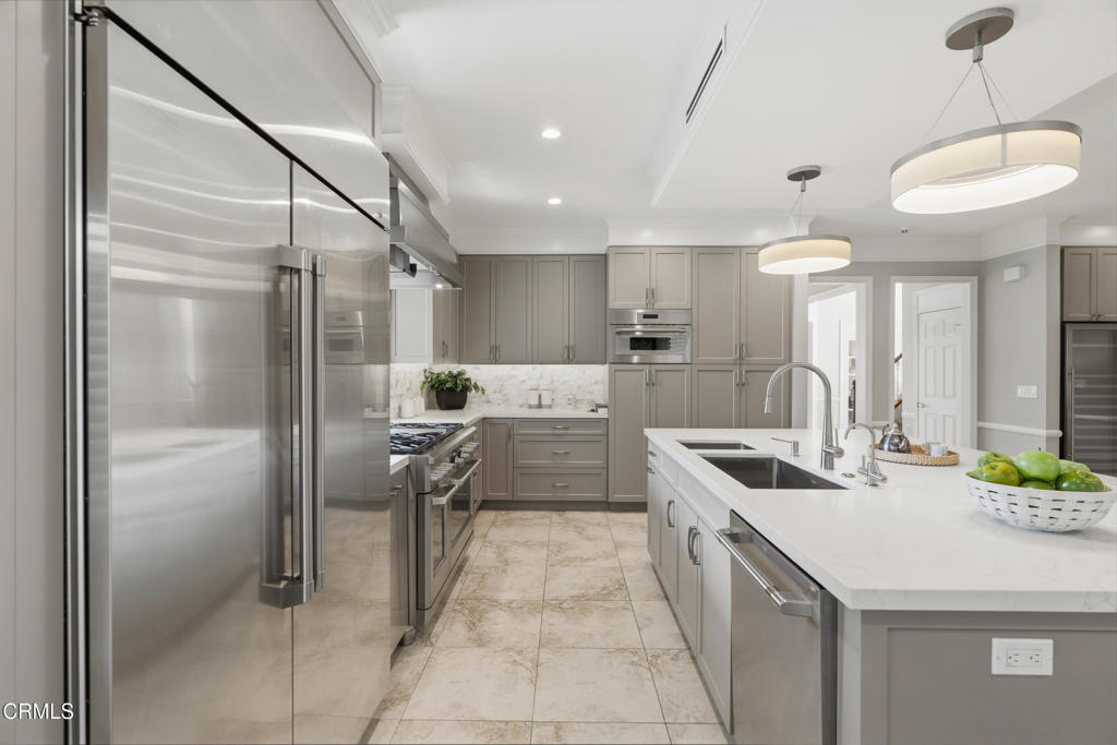11543 Ragusa Drive Rancho Cucamonga, CA 91701 - Photo 25 of 69 a kitchen with stainless steel appliances a sink stove and refrigerator