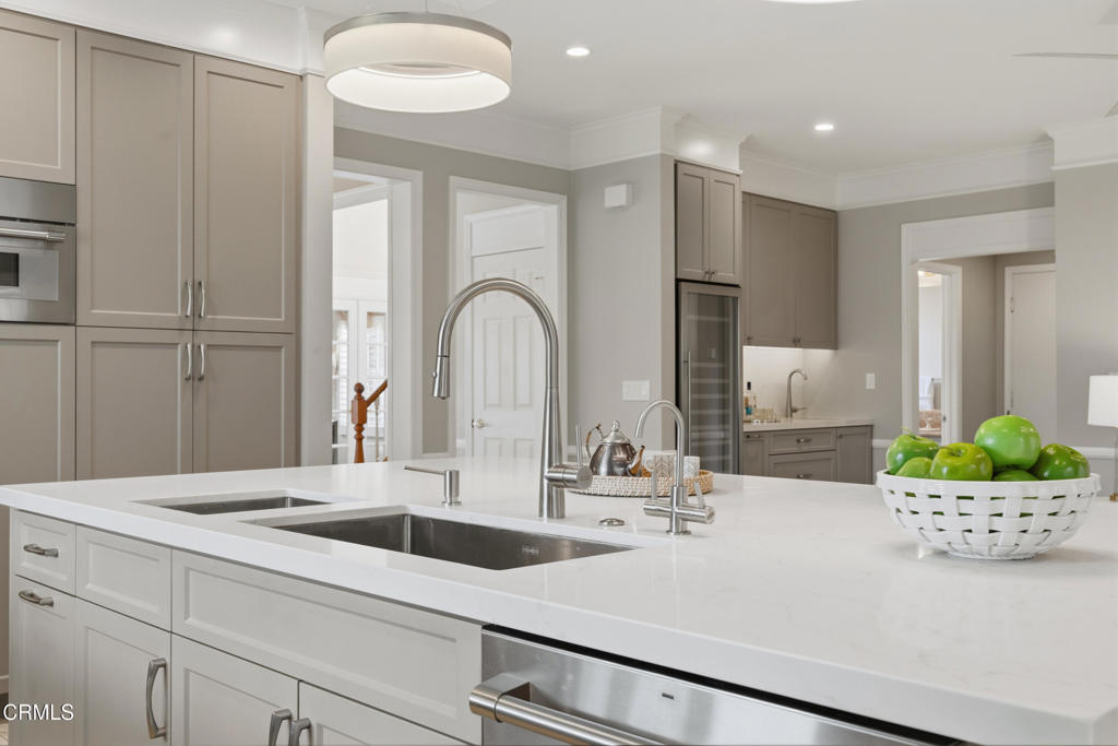 11543 Ragusa Drive Rancho Cucamonga, CA 91701 - Photo 26 of 69 a kitchen with a refrigerator and a sink