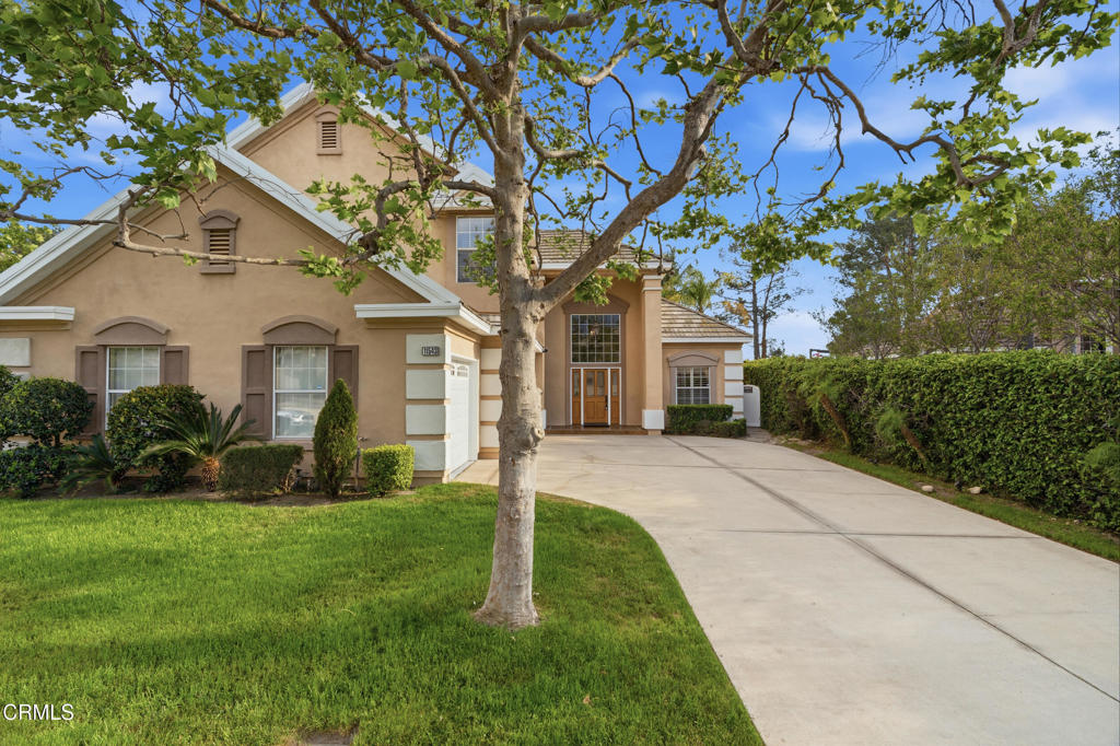 11543 Ragusa Drive Rancho Cucamonga, CA 91701 - Photo 3 of 69 a front view of a house with a yard and large tree