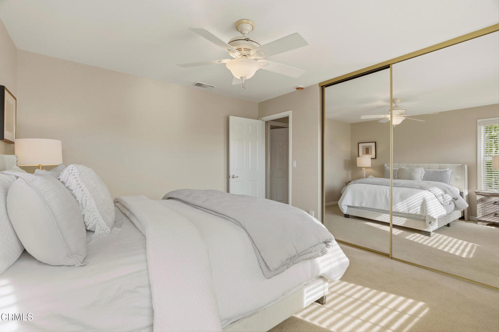 11543 Ragusa Drive Rancho Cucamonga, CA 91701 - Photo 32 of 69 a spacious bedroom with a bed and a chandelier