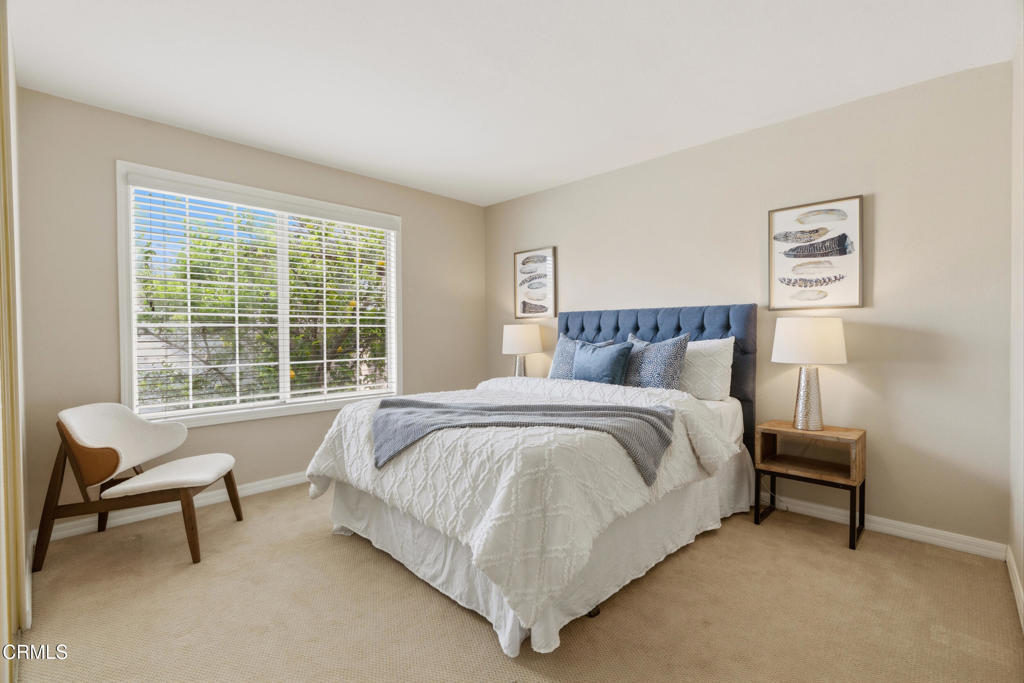 11543 Ragusa Drive Rancho Cucamonga, CA 91701 - Photo 35 of 69 a bed sitting in a bedroom next to a window with a chair