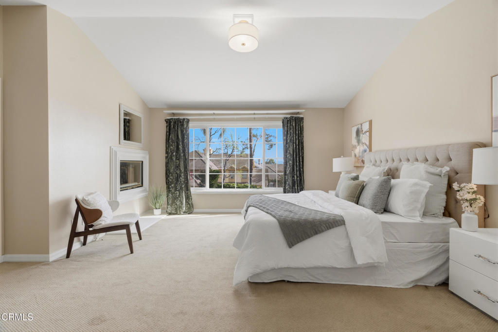 11543 Ragusa Drive Rancho Cucamonga, CA 91701 - Photo 39 of 69 a spacious bedroom with a bed and a chair