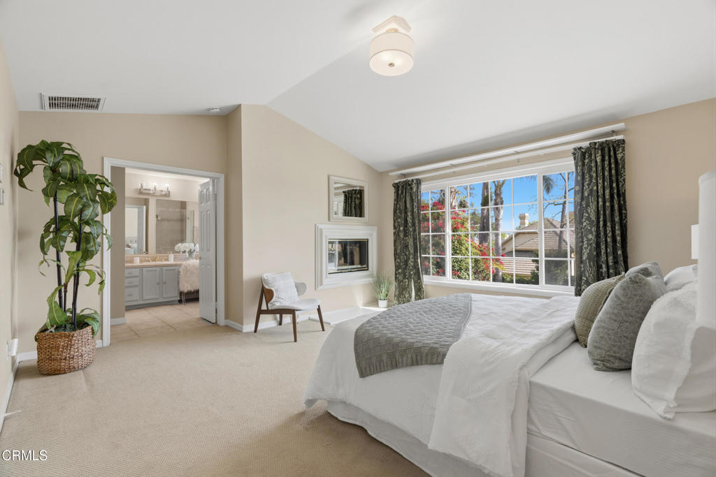 11543 Ragusa Drive Rancho Cucamonga, CA 91701 - Photo 41 of 69 a bedroom with a large bed and a large window