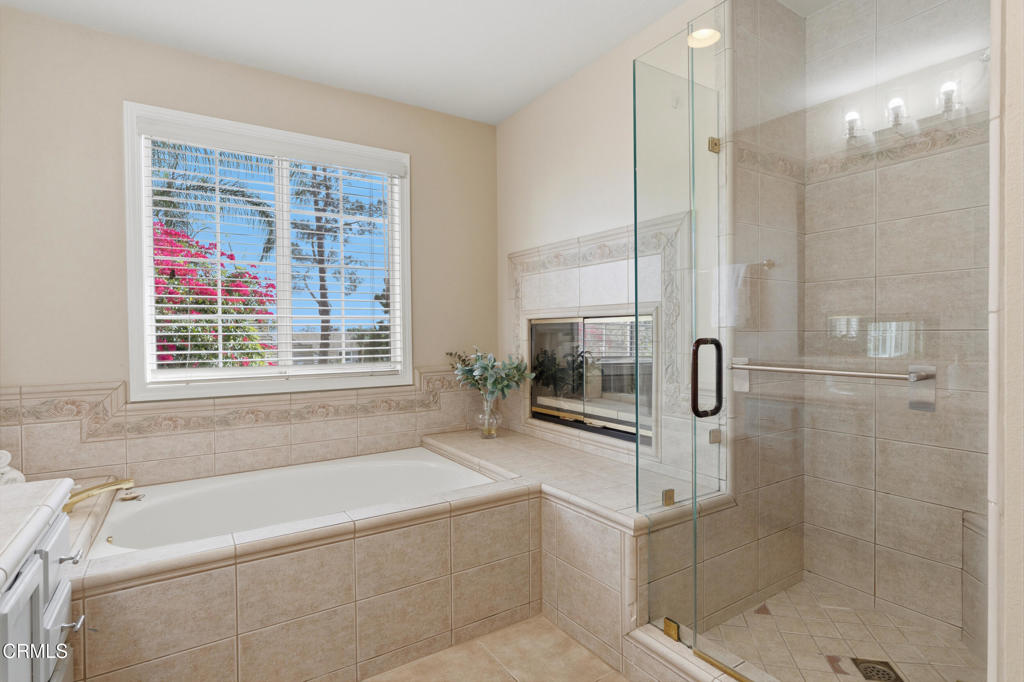 11543 Ragusa Drive Rancho Cucamonga, CA 91701 - Photo 44 of 69 a bathroom with a bathtub and a shower