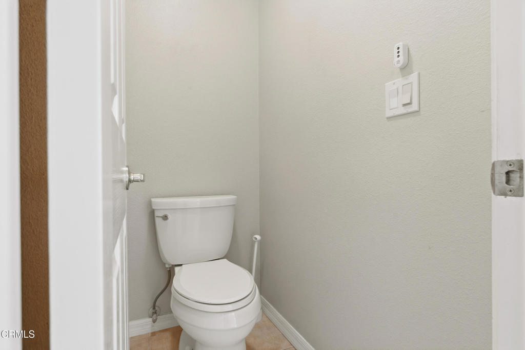11543 Ragusa Drive Rancho Cucamonga, CA 91701 - Photo 45 of 69 a white toilet sitting next to a white sink