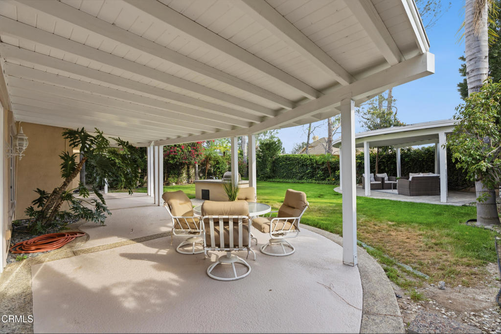 11543 Ragusa Drive Rancho Cucamonga, CA 91701 - Photo 51 of 69 a view of a patio with chairs and floor to ceiling window