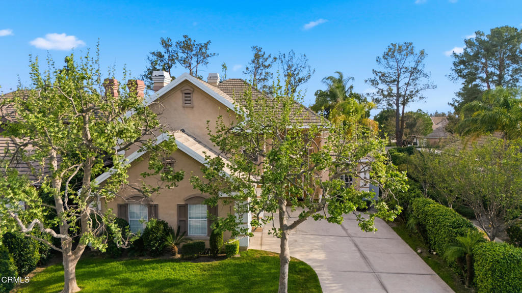 11543 Ragusa Drive Rancho Cucamonga, CA 91701 - Photo 61 of 69 a view of a house with a yard and potted plants