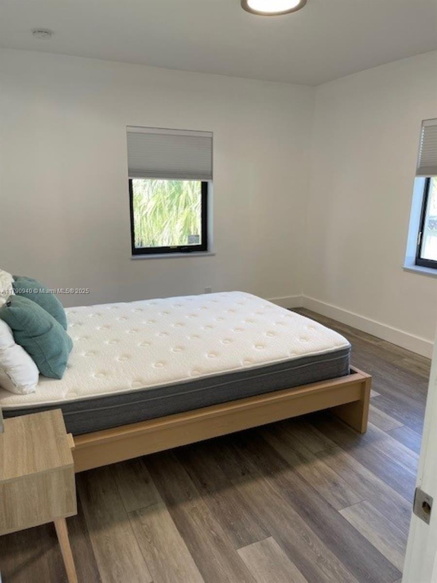 2141 Southwest 14th Terrace, Unit 4 Miami, FL 33145 - Photo 11 of 15 a bedroom with a bed and window