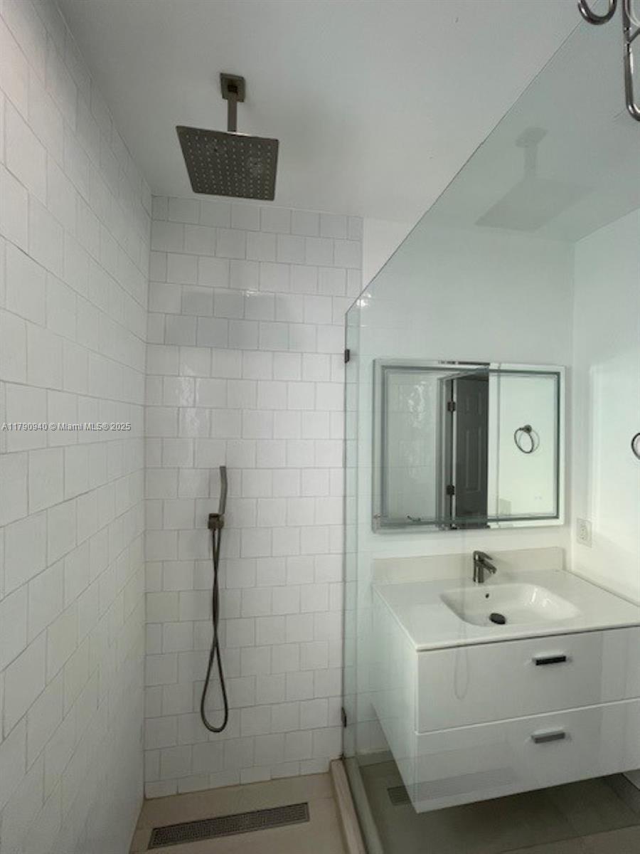 2141 Southwest 14th Terrace, Unit 4 Miami, FL 33145 - Photo 13 of 15 a bathroom with a bathtub and a sink