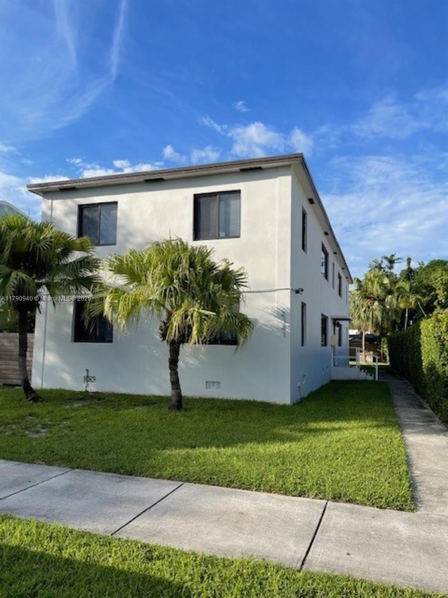 2141 Southwest 14th Terrace, Unit 4 Miami, FL 33145 - Photo 15 of 15 a front view of a house with garden