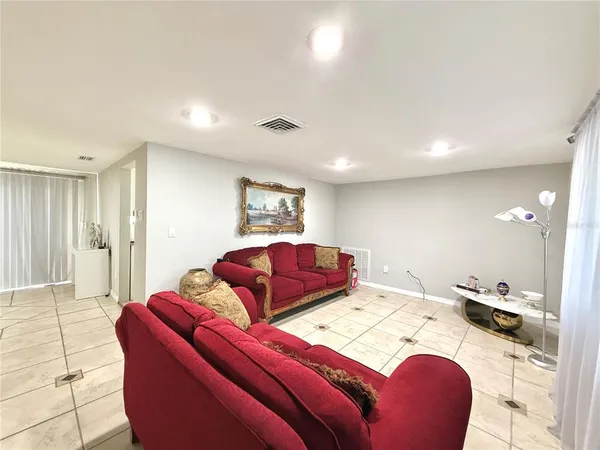 a living room with furniture and a table