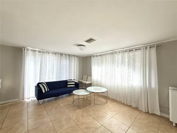 a living room with furniture and a area