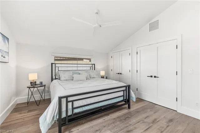 a bedroom with a bed and a table